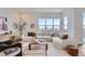 Bright and airy living room featuring a large sectional sofa and ample natural light at 960 Superior Dr, Superior, CO 80027