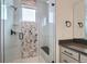 Walk-in shower with geometric tile and built-in seat at 960 Superior Dr, Superior, CO 80027