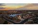 Beautiful sunset view of the neighborhood homes and serene pond at 27596 E Jamison Cir, Aurora, CO 80016