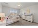 Cozy bedroom with natural light, carpeted floors, and a bright, fresh feel at 27596 E Jamison Cir, Aurora, CO 80016