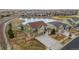 Aerial view of a two-story home showcasing a manicured lawn and a three car garage at 27596 E Jamison Cir, Aurora, CO 80016