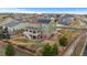 Aerial view of a two-story home featuring a backyard with patio, deck and solar panels at 27596 E Jamison Cir, Aurora, CO 80016
