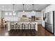 Bright kitchen with a large center island, stainless steel appliances, and ample cabinet space at 27596 E Jamison Cir, Aurora, CO 80016