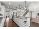 Open-concept kitchen featuring a large island with bar seating, perfect for entertaining at 27596 E Jamison Cir, Aurora, CO 80016
