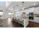 Spacious kitchen with granite countertops, a large island, and modern appliances at 27596 E Jamison Cir, Aurora, CO 80016
