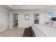 Bright and spacious main bedroom with tray ceiling and access to both a bathroom and walk-in closet at 27596 E Jamison Cir, Aurora, CO 80016