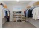Spacious walk-in closet with custom shelving and ample storage for clothing and shoes at 27596 E Jamison Cir, Aurora, CO 80016