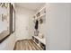Functional entryway with built-in shelving, bench seating, and ample storage space at 1350 Loraine N Cir, Lafayette, CO 80026