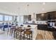 Gourmet kitchen featuring a large center island, stainless steel appliances, and modern finishes at 1350 Loraine N Cir, Lafayette, CO 80026