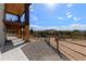 Covered patio with stunning views and a horse corral at 1708 Creedmoor Ct, Castle Rock, CO 80109