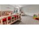 Basement bedroom with a wooden bed frame and toys at 1708 Creedmoor Ct, Castle Rock, CO 80109