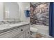 Bathroom with granite countertop and updated tile at 1708 Creedmoor Ct, Castle Rock, CO 80109