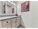 Bathroom with granite countertop, updated vanity, and a large mirror at 1708 Creedmoor Ct, Castle Rock, CO 80109