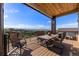 Deck with mountain views and outdoor dining set at 1708 Creedmoor Ct, Castle Rock, CO 80109