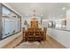 Bright dining room features a rustic wooden table with leather chairs, and a large window at 1708 Creedmoor Ct, Castle Rock, CO 80109