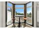 Cozy kitchen nook with a small table and two stools, offering scenic views at 1708 Creedmoor Ct, Castle Rock, CO 80109