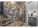 Modern shower with glass enclosure and stylish tile at 1708 Creedmoor Ct, Castle Rock, CO 80109