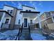 Two-story modern home with white siding, gray brick accents, and a covered front porch at 22831 E Stanford Ln # A, Aurora, CO 80015