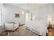 Comfortable bedroom featuring a bed, chair, and vintage-style rug at 2034 Dahlia St # 1, Denver, CO 80207