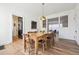 Cozy dining room adjacent to the kitchen, featuring classic hardwood floors at 2034 Dahlia St # 1, Denver, CO 80207