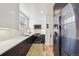 Modern kitchen featuring stainless steel appliances, white subway tile backsplash, and quartz countertops at 2034 Dahlia St # 1, Denver, CO 80207