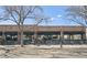 Charming brick restaurant exterior featuring outdoor seating under awnings for a pleasant dining experience at 2034 Dahlia St # 1, Denver, CO 80207