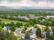 Scenic view of neighborhood with lush greenery, park and mountain backdrop at 2777 W 106Th Cir, Denver, CO 80234