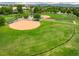 An aerial view of a well-maintained baseball field and grassy surroundings at 2777 W 106Th Cir, Denver, CO 80234