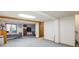 Spacious finished basement featuring carpeted flooring, a bedroom area, and ample storage space at 2777 W 106Th Cir, Denver, CO 80234