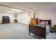Spacious finished basement with a large bed, drawers, and good lighting at 2777 W 106Th Cir, Denver, CO 80234