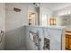 Contemporary bathroom featuring large walk-in shower, storage niche, and stylish fixtures at 2777 W 106Th Cir, Denver, CO 80234