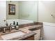 Bathroom featuring granite countertops, stylish sink and faucet, and a classic vanity cabinet at 2777 W 106Th Cir, Denver, CO 80234
