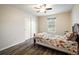 Well-lit bedroom with a ceiling fan, closet, and a large window for natural light at 2777 W 106Th Cir, Denver, CO 80234