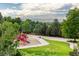 View of the community park, trees, and playground at 2777 W 106Th Cir, Denver, CO 80234