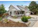Inviting two-story home with solar panels, a welcoming porch, and beautiful, low-maintenance landscaping at 2777 W 106Th Cir, Denver, CO 80234