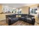 Spacious living area with laminate flooring, a comfortable sectional sofa, and lots of natural light at 2777 W 106Th Cir, Denver, CO 80234