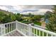 Scenic view from a deck overlooking a lush green landscape, playground, and mountain views in the distance at 2777 W 106Th Cir, Denver, CO 80234