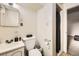 Small bathroom includes a toilet, sink, and shower at 7875 Cyd Dr, Denver, CO 80221