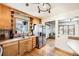 Bright kitchen featuring stainless steel appliances, wood cabinets and hardwood floors at 7875 Cyd Dr, Denver, CO 80221
