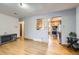 Inviting living room with hardwood floors and an open view of the adjacent kitchen at 7875 Cyd Dr, Denver, CO 80221