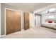 Spacious bedroom featuring ample closet space and neutral carpeting at 7875 Cyd Dr, Denver, CO 80221