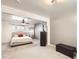 Bright main bedroom featuring neutral colors, ceiling fan and carpeted floors at 7875 Cyd Dr, Denver, CO 80221