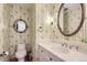Cozy powder room features patterned wallpaper, a decorative mirror, and pedestal sink at 3825 S Peach Way, Denver, CO 80237