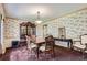 Formal dining room featuring decorative wallpaper, vintage furniture and ample seating at 3825 S Peach Way, Denver, CO 80237