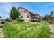 Enjoy outdoor living with a spacious deck and backyard, perfect for entertaining at 19382 Dunraven St, Parker, CO 80134