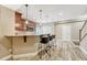 Charming bar area features stone countertops, wood cabinets, and stylish pendant lighting at 19382 Dunraven St, Parker, CO 80134