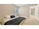 This inviting bedroom offers a comfortable space and entry into the hallway at 19382 Dunraven St, Parker, CO 80134