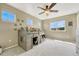 Bright bedroom with a unique bunk bed, carpeted floors, and lots of natural light at 19382 Dunraven St, Parker, CO 80134