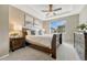 Serene bedroom with tray ceilings, soft carpeting, and a large window providing natural light at 19382 Dunraven St, Parker, CO 80134