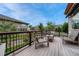 Cozy deck with chairs and table, perfect for outdoor relaxation and enjoying the view at 19382 Dunraven St, Parker, CO 80134